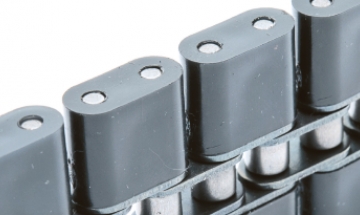 Roller chains with plastic parts
